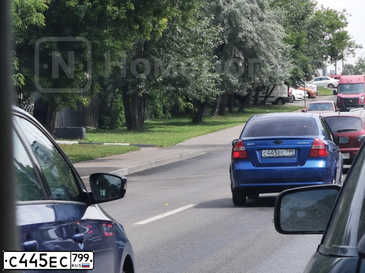 Фото автомобиля CHEVROLET AVEO, 2007 — госномер К125КМ136. Цвет: синий