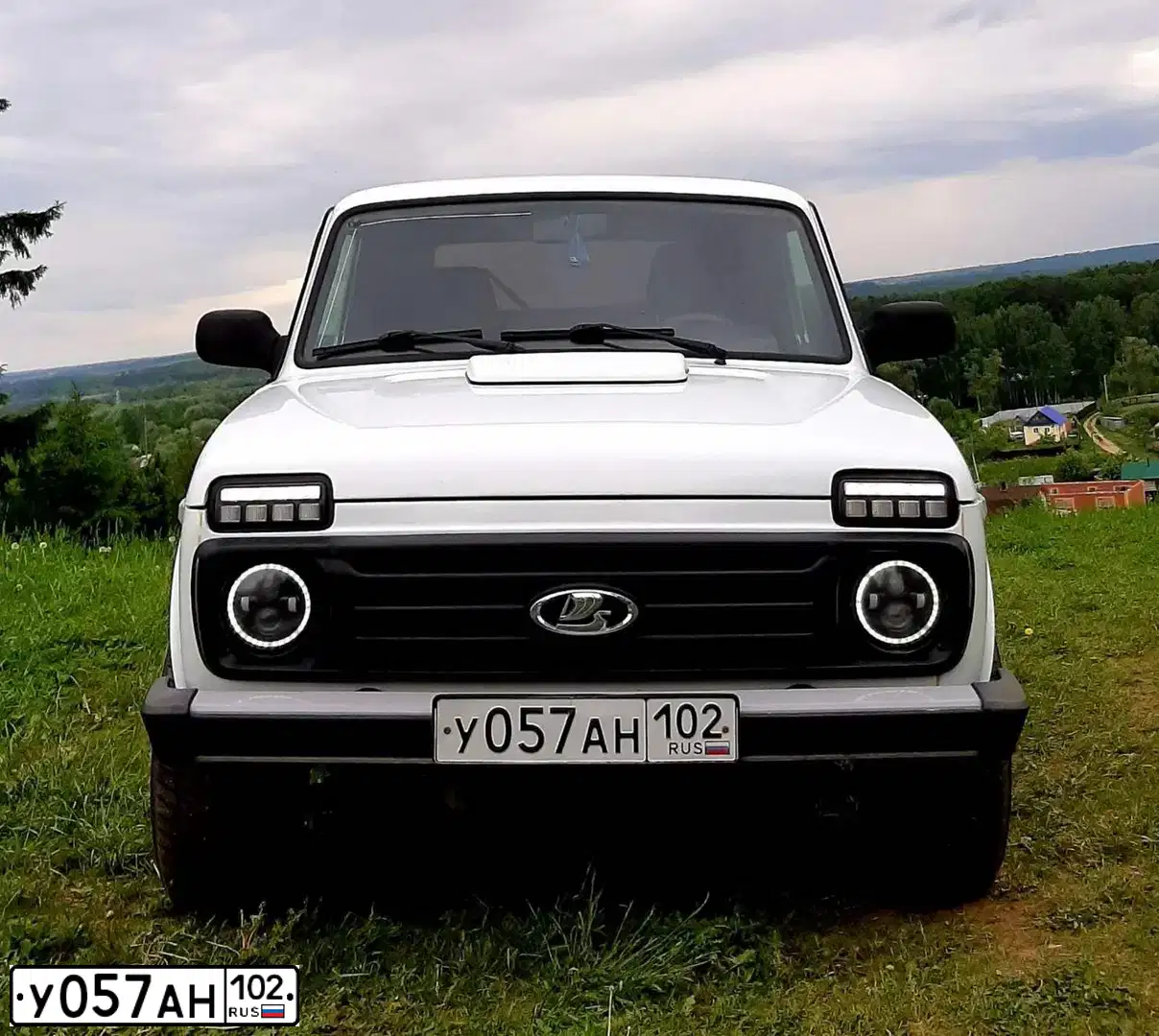 Фото автомобиля LADA 2121 NIVA, 2016 — госномер Т244УС18. Цвет: ЯРКО-БЕЛЫЙ