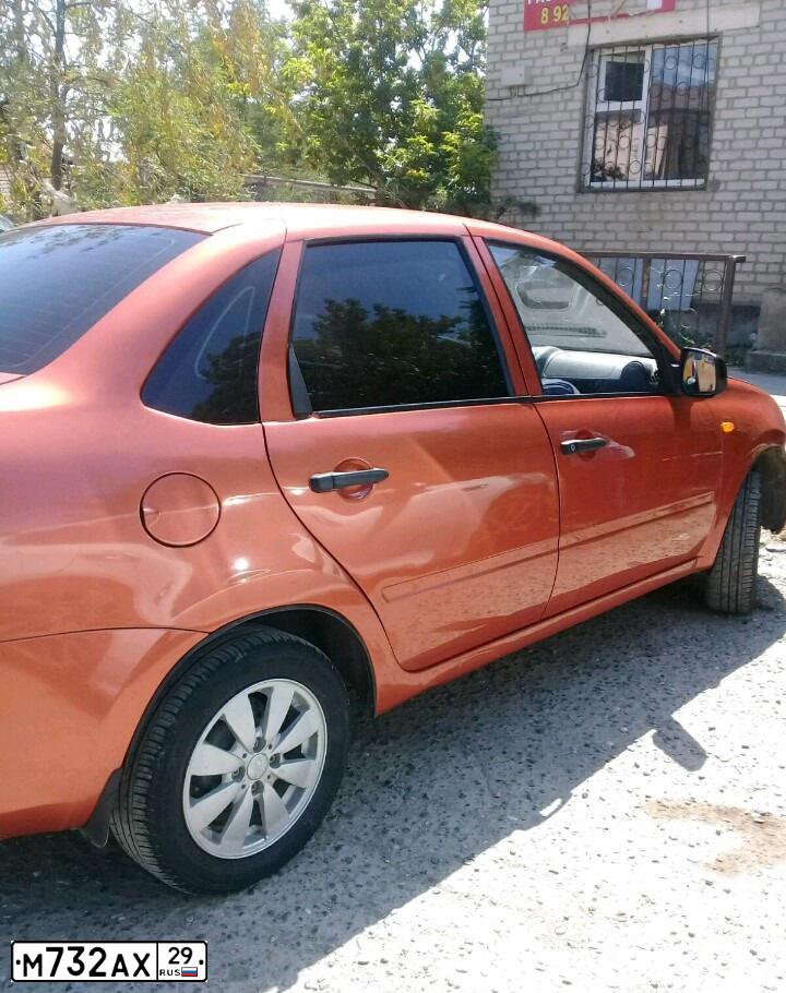 Фото автомобиля LADA 2190 GRANTA, 2014 — госномер М732АХ29. Цвет: Оранжевый