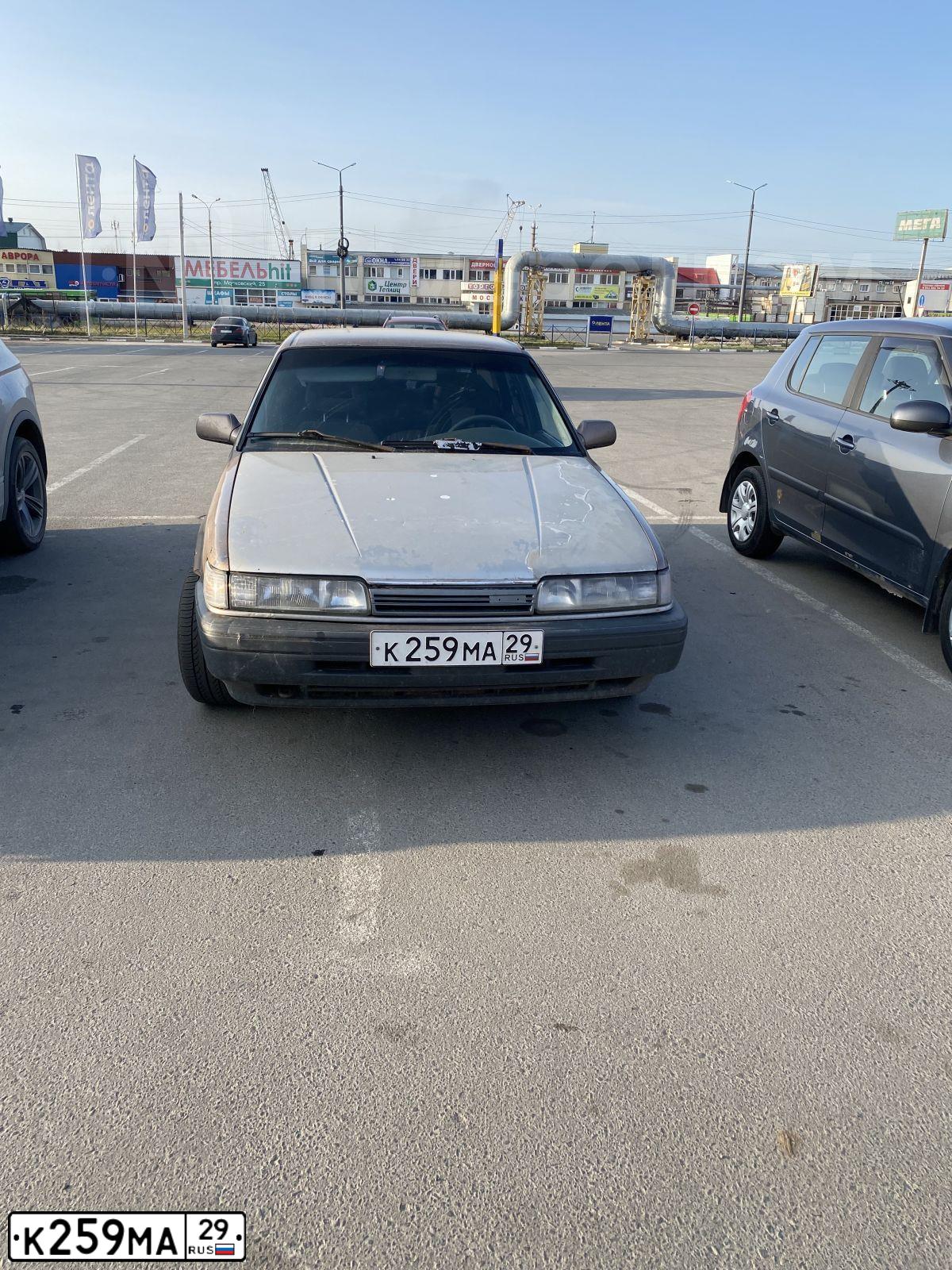Фото автомобиля MAZDA 626, 1991 — госномер Р898СК29. Цвет: КОРИЧНЕВЫЙ