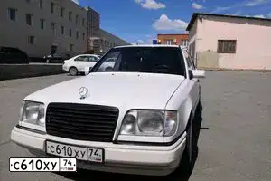 Фото автомобиля MERCEDES E-KLASSE, 1994 — госномер С610ХУ74. Цвет: Белый