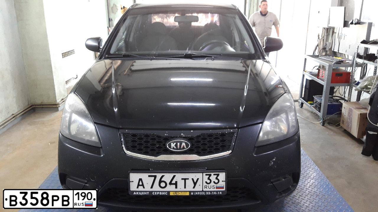 Фото автомобиля KIA RIO, 2011 — госномер Т205АА152. Цвет: ЧЕРНЫЙ