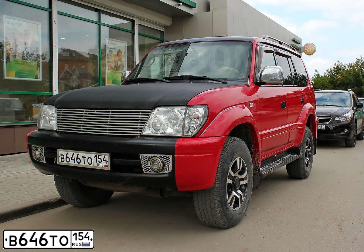 Фото автомобиля TOYOTA LANDCRUISER, 1999 — госномер Е003НА199. Цвет: КРАСНЫЙ ЧЕРНЫЙ