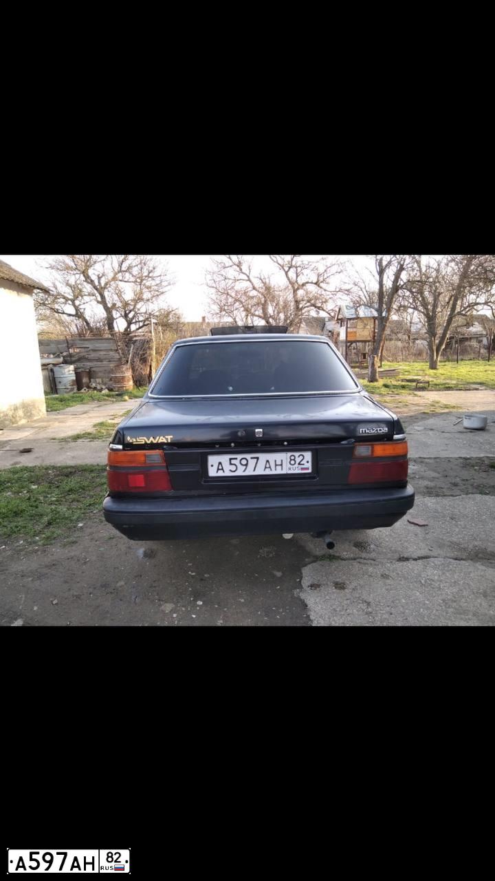 Фото автомобиля МАЗДА 626, 1986 — госномер А597АН82. Цвет: СЕРО-ГОЛУБОЙ