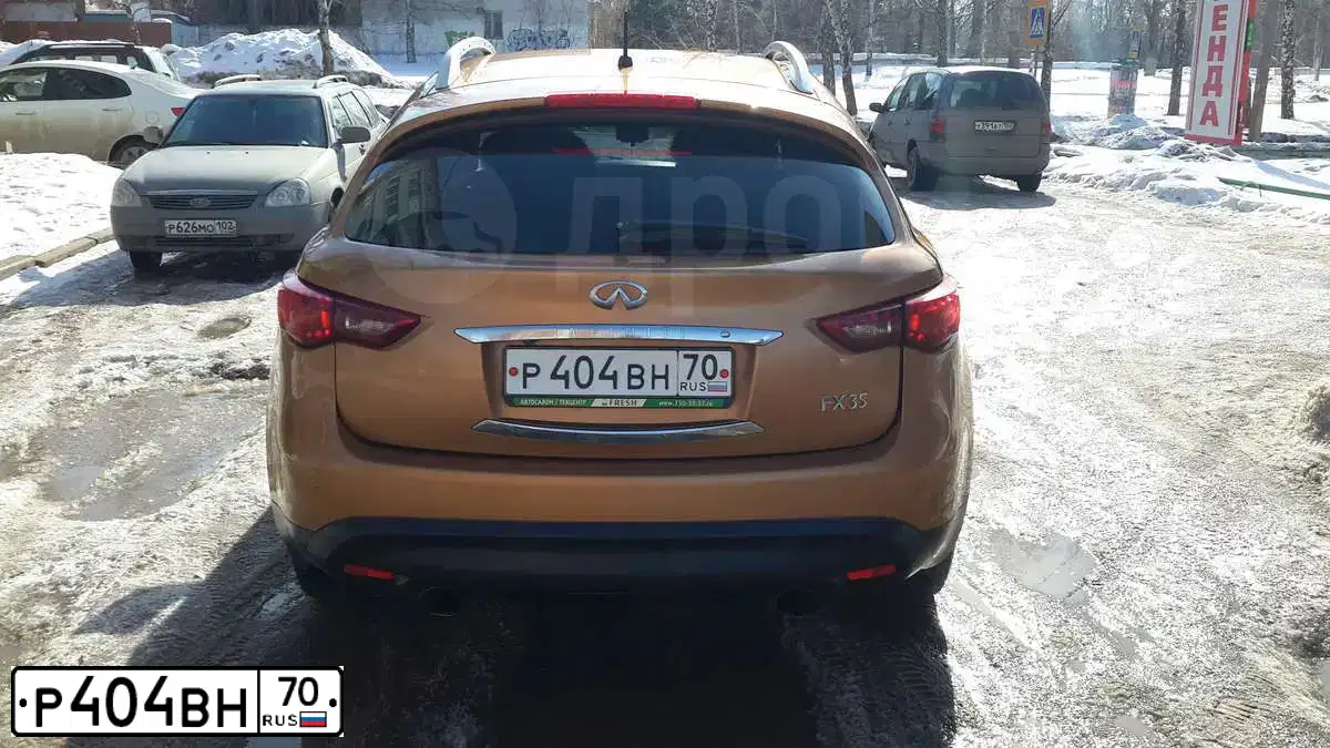 Фото автомобиля INFINITI QX70 /FX/, 2008 — госномер Р404ВН70. Цвет: Красный