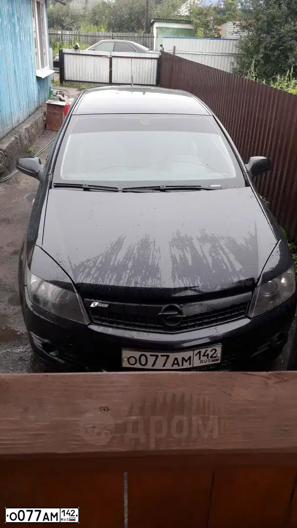 Фото автомобиля OPEL ASTRA, 2007 — госномер Р662ЕХ70. Цвет: ЧЕРНЫЙ