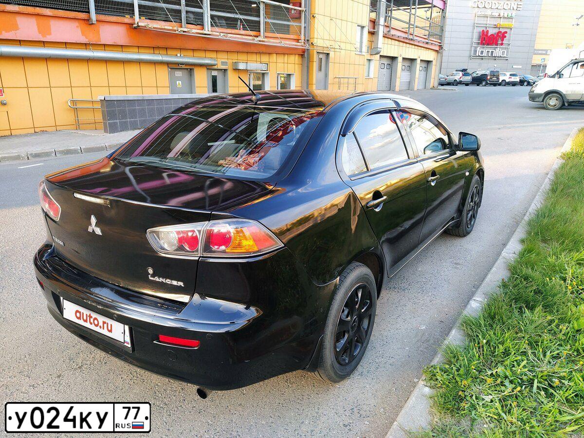 Фото автомобиля MITSUBISHI LANCER, 2013 — госномер О399НН799. Цвет: ЧЕРНЫЙ