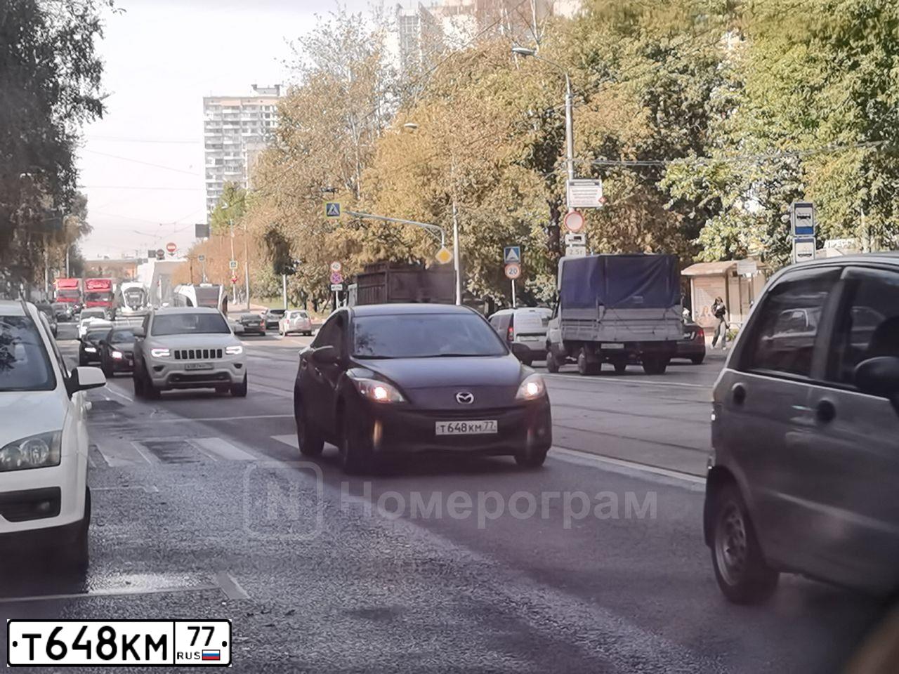 Фото автомобиля MAZDA 3, 2013 — госномер Т648КМ77. Цвет: ЧЕРНЫЙ