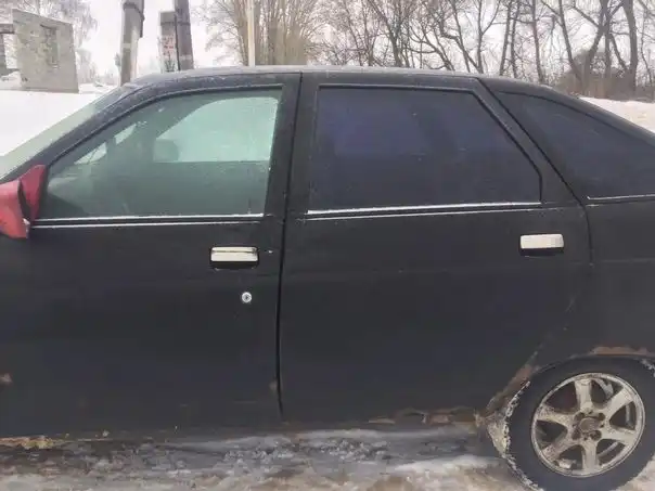 Фото автомобиля LADA 2112 LADA, 2003 — госномер Х121ВР31. Цвет: ГРАФИТОВЫЙ МЕТАЛЛИК