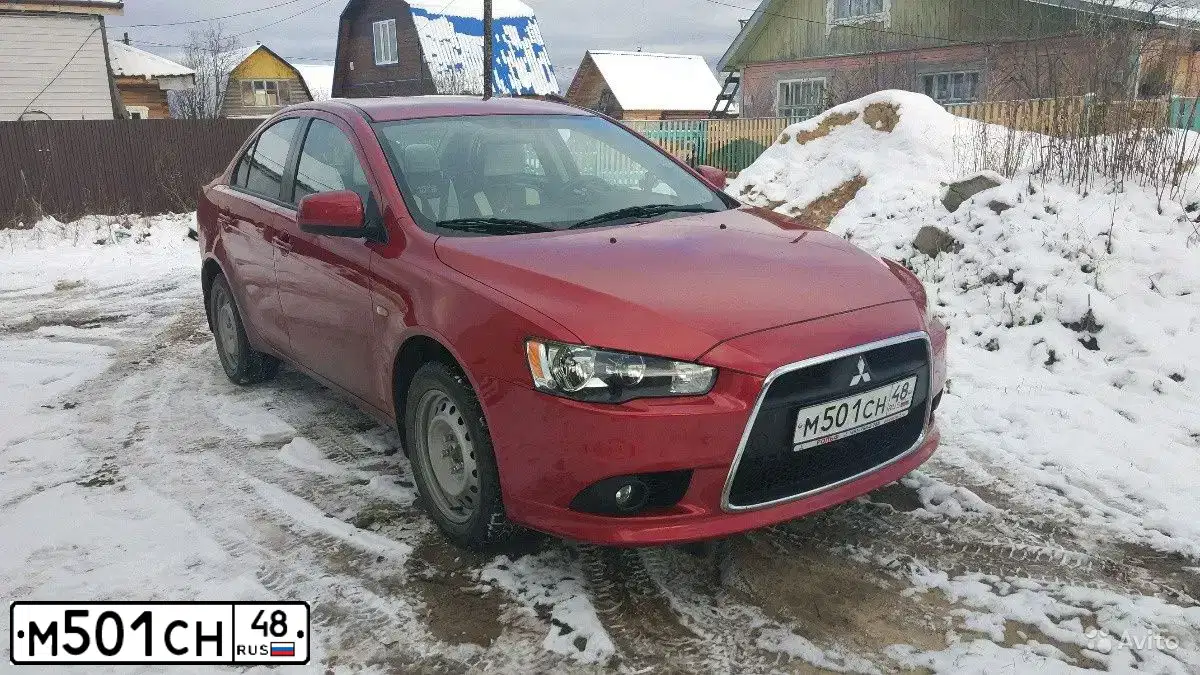 Фото автомобиля MITSUBISHI LANCER, 2014 — госномер М501СН48. Цвет: Красный