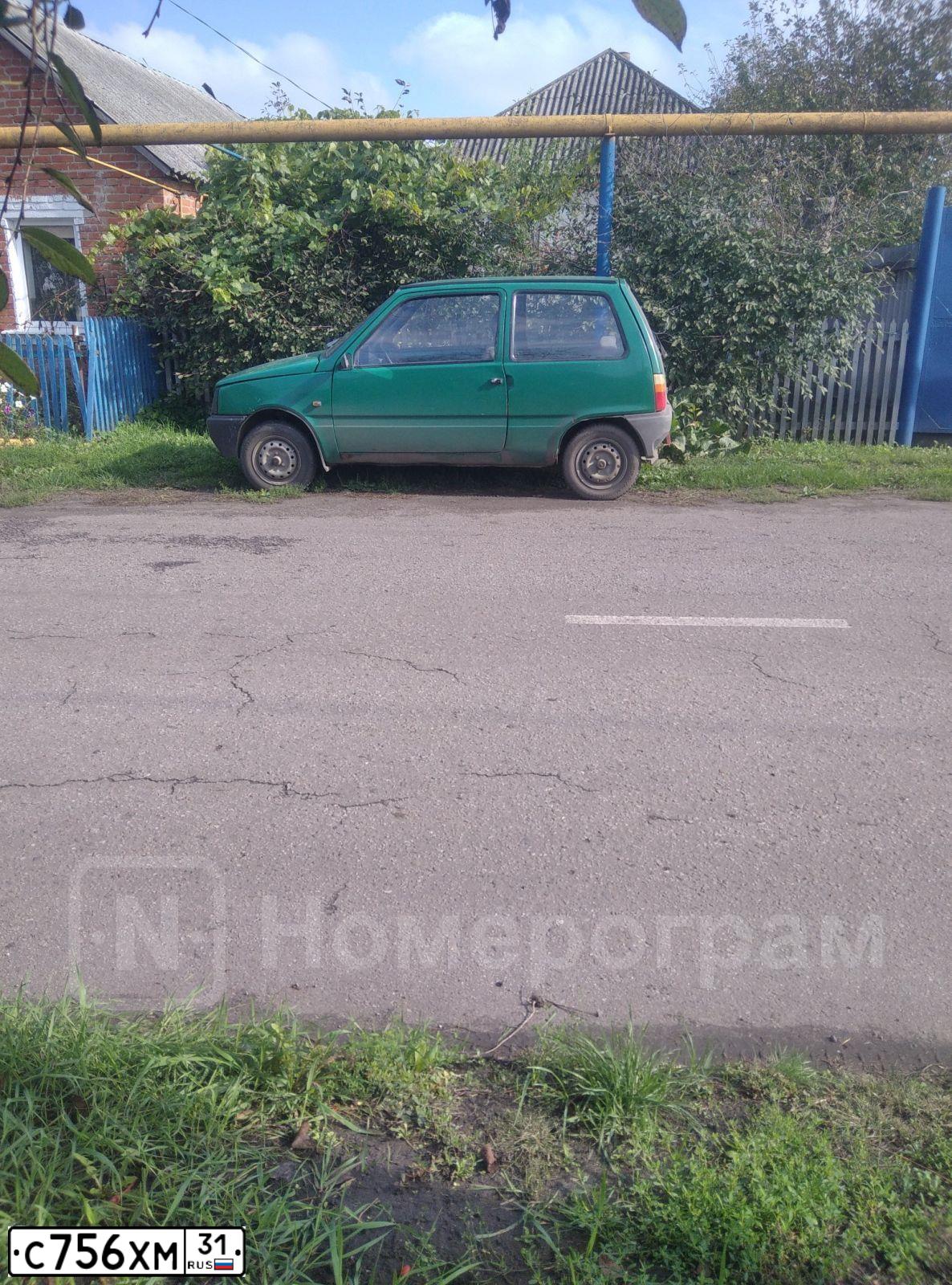 Фото автомобиля LADA 2111, 2003 — госномер С756ХМ31. Цвет: ТЕМНО-ЗЕЛЕНЫЙ