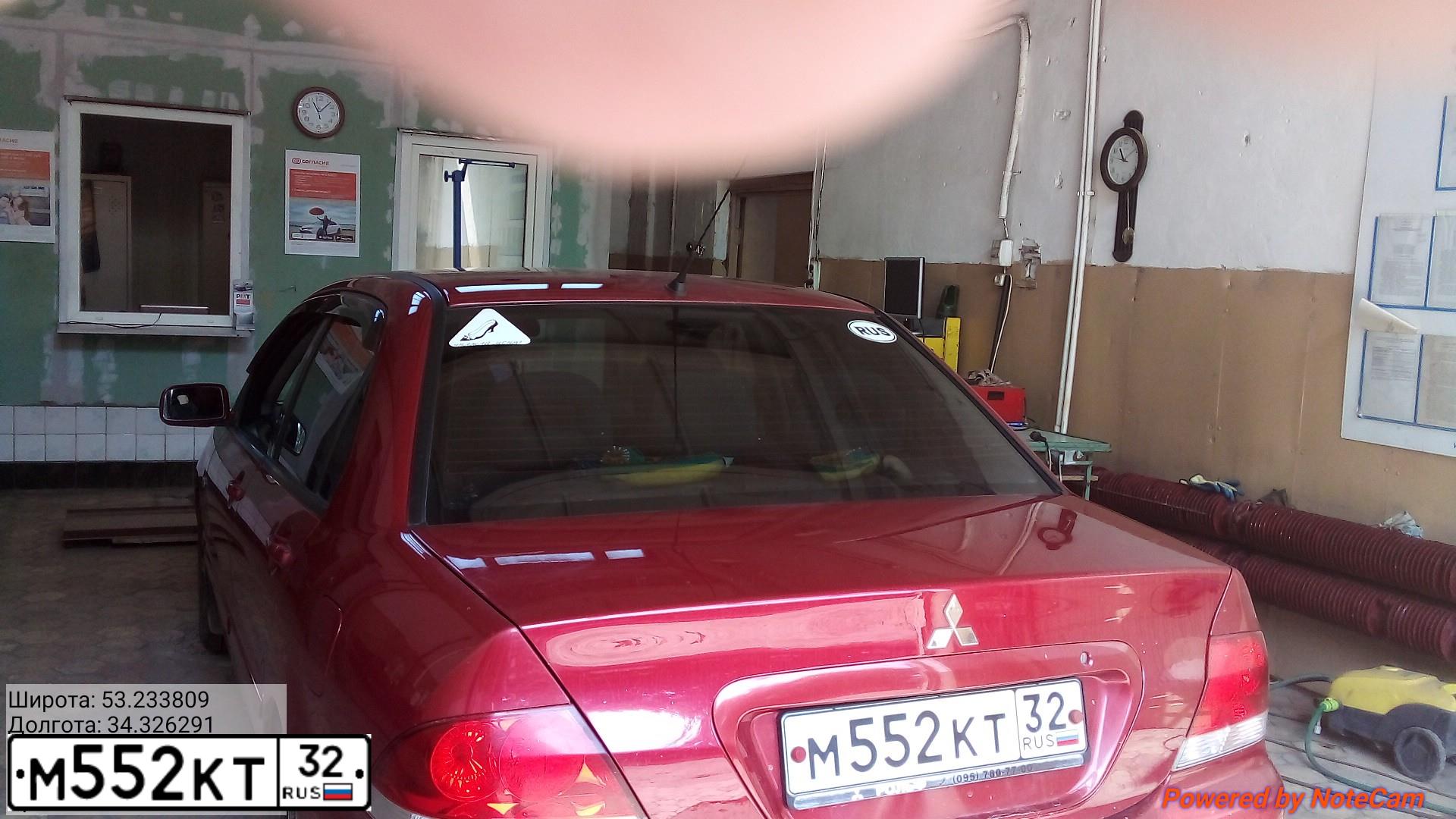 Фото автомобиля MITSUBISHI LANCER, 2005 — госномер М552КТ32. Цвет: КРАСНЫЙ