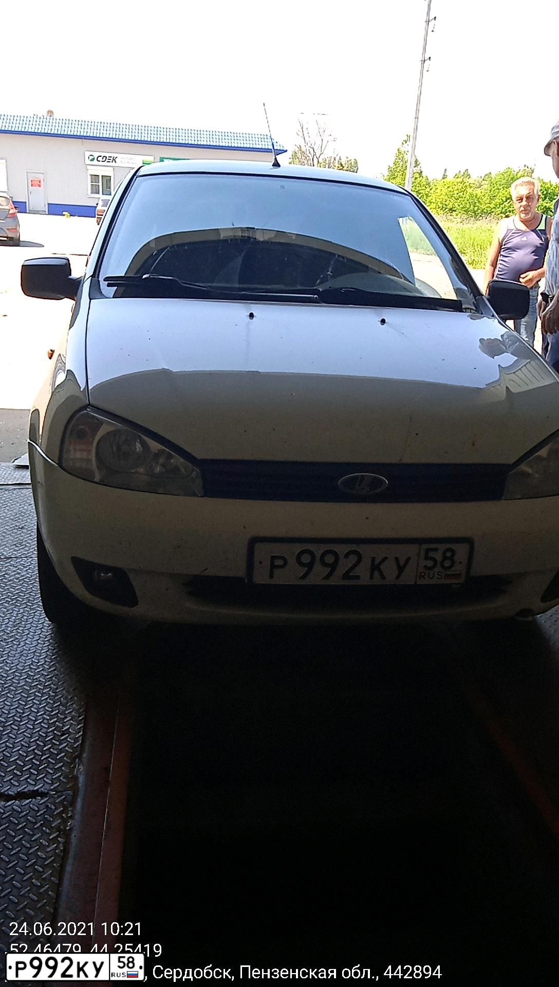 Фото автомобиля LADA 1117 KALINA, 2011 — госномер Р992КУ58. Цвет: Белый