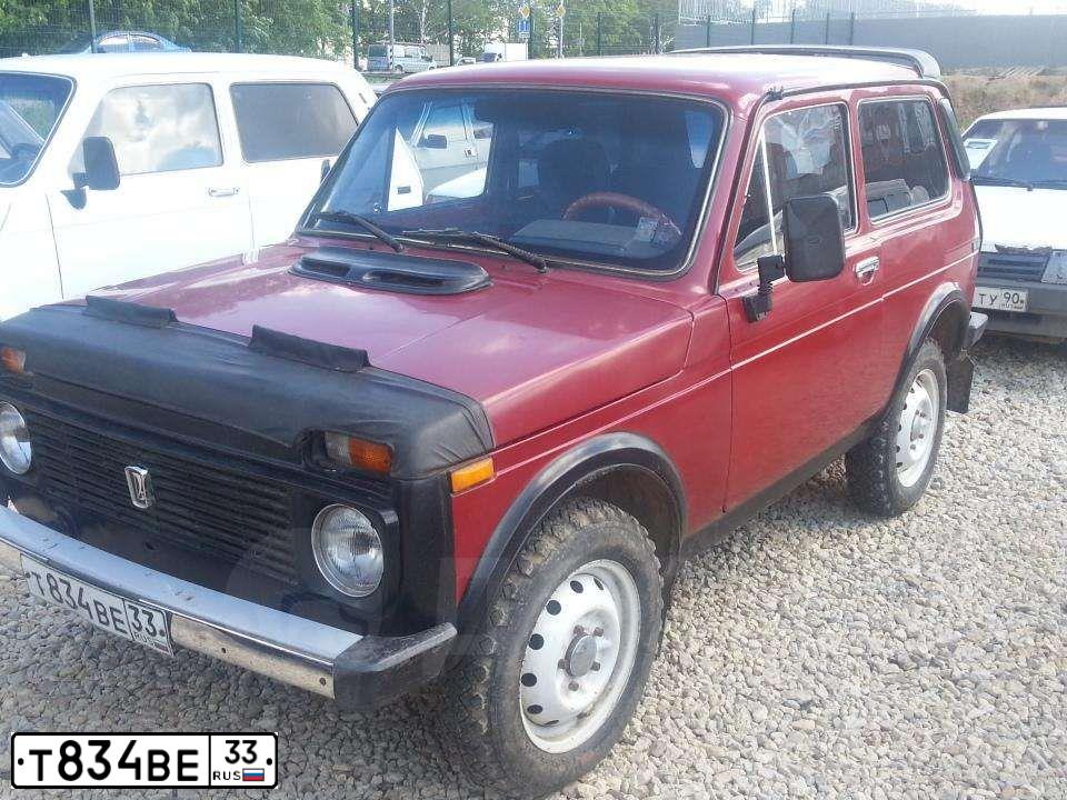 Фото автомобиля LADA 2121 NIVA, 1997 — госномер Т834ВЕ33. Цвет: ВИШНЕВЫЙ