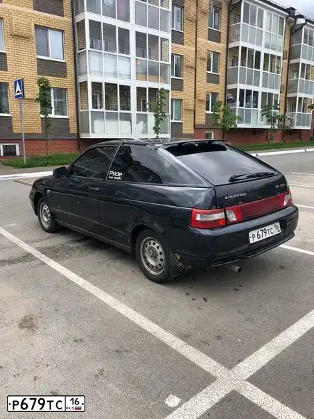 Фото автомобиля LADA 2112 LADA, 2009 — госномер Е452КУ156. Цвет: ГРАФИТОВЫЙ МЕТАЛЛИК