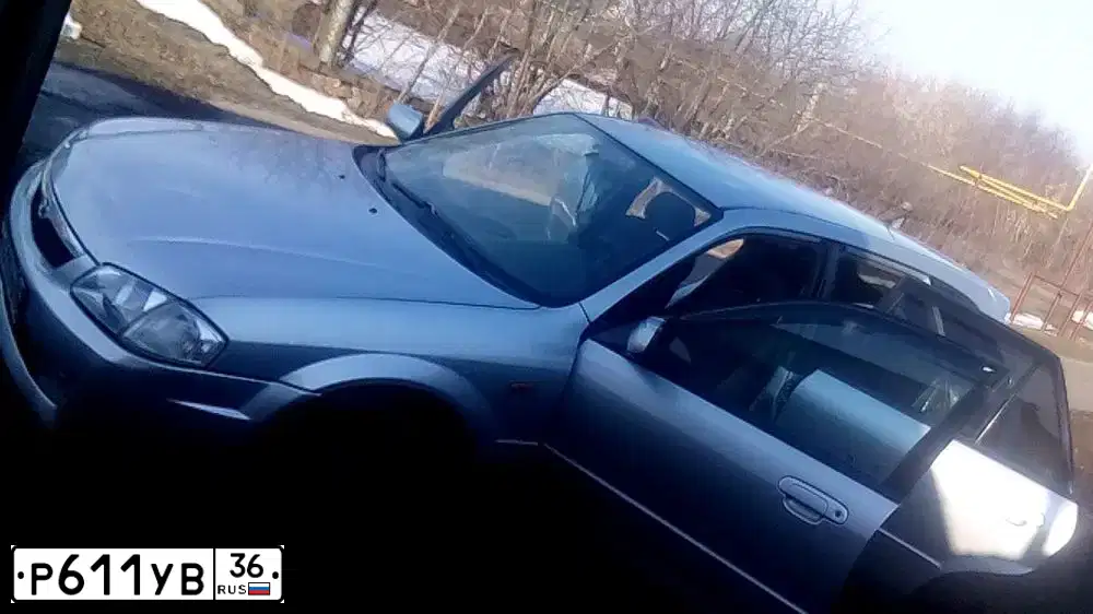 Фото автомобиля MAZDA 323, 1999 — госномер А206ОО142. Цвет: Серебристый