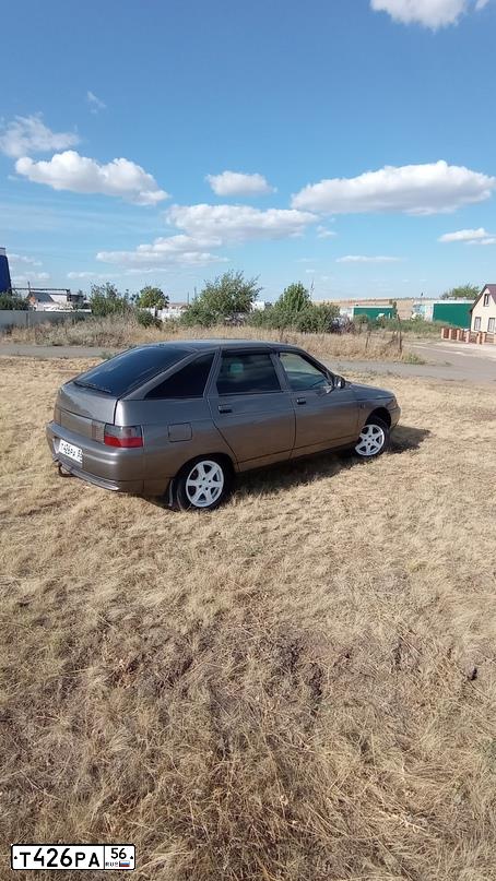 Фото автомобиля LADA 2112, 2007 — госномер Е713ХВ156. Цвет: СЕРЕБРИСТО-КОРИЧНЕВЫЙ