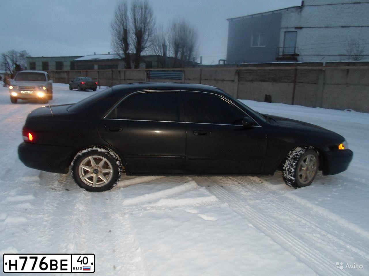 Фото автомобиля MAZDA 626, 1999 — госномер Н660МВ136. Цвет: ЧЕРНЫЙ