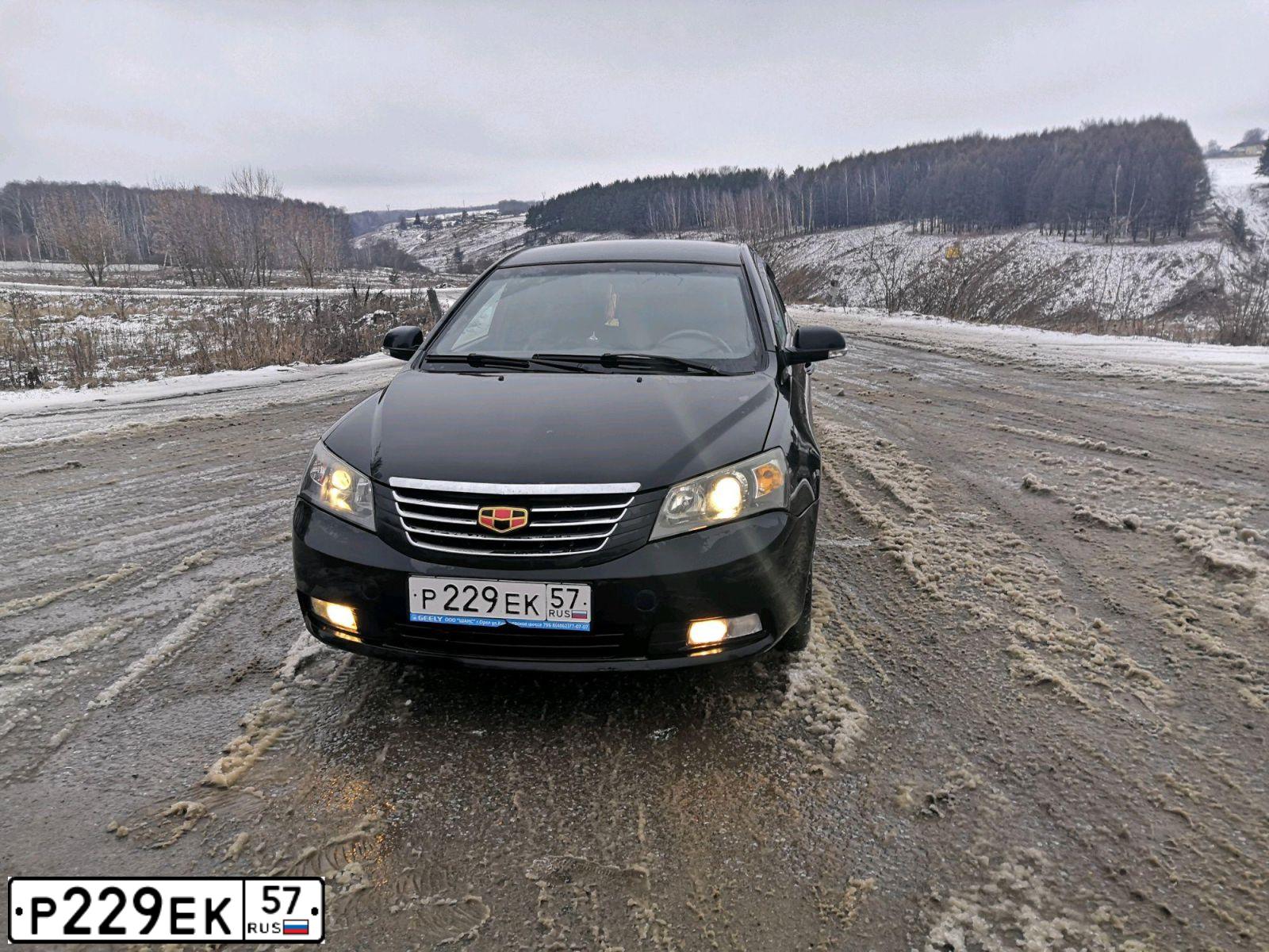 Фото автомобиля GEELY EMGRAND (FE-1), 2014 — госномер О716ХН32. Цвет: ЧЕРНЫЙ