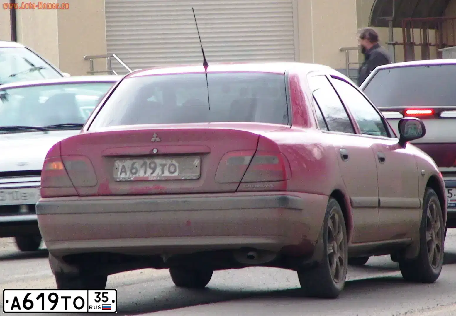 Фото автомобиля MITSUBISHI CARISMA, 2003 — госномер А619ТО35. Цвет: КРАСНЫЙ
