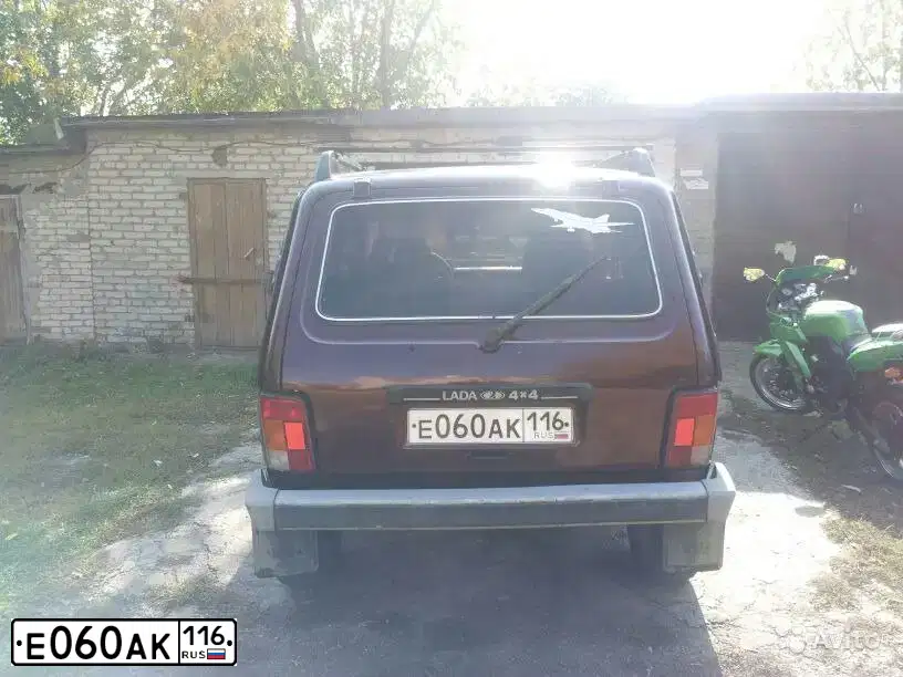 Фото автомобиля LADA 2121 NIVA, 2007 — госномер Е060АК116. Цвет: ТЕМНО-ВИШНЕВЫЙ