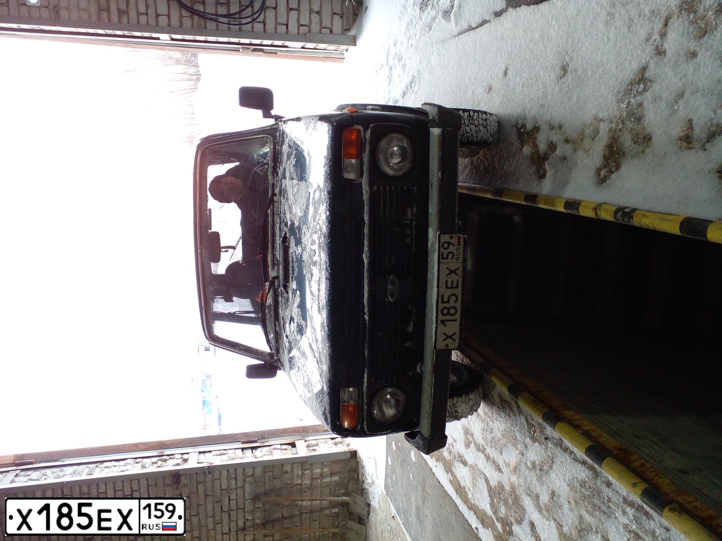Фото автомобиля LADA 2121 NIVA, 2009 — госномер Х185ЕХ59. Цвет: ТЕМНО-ЗЕЛЕНЫЙ