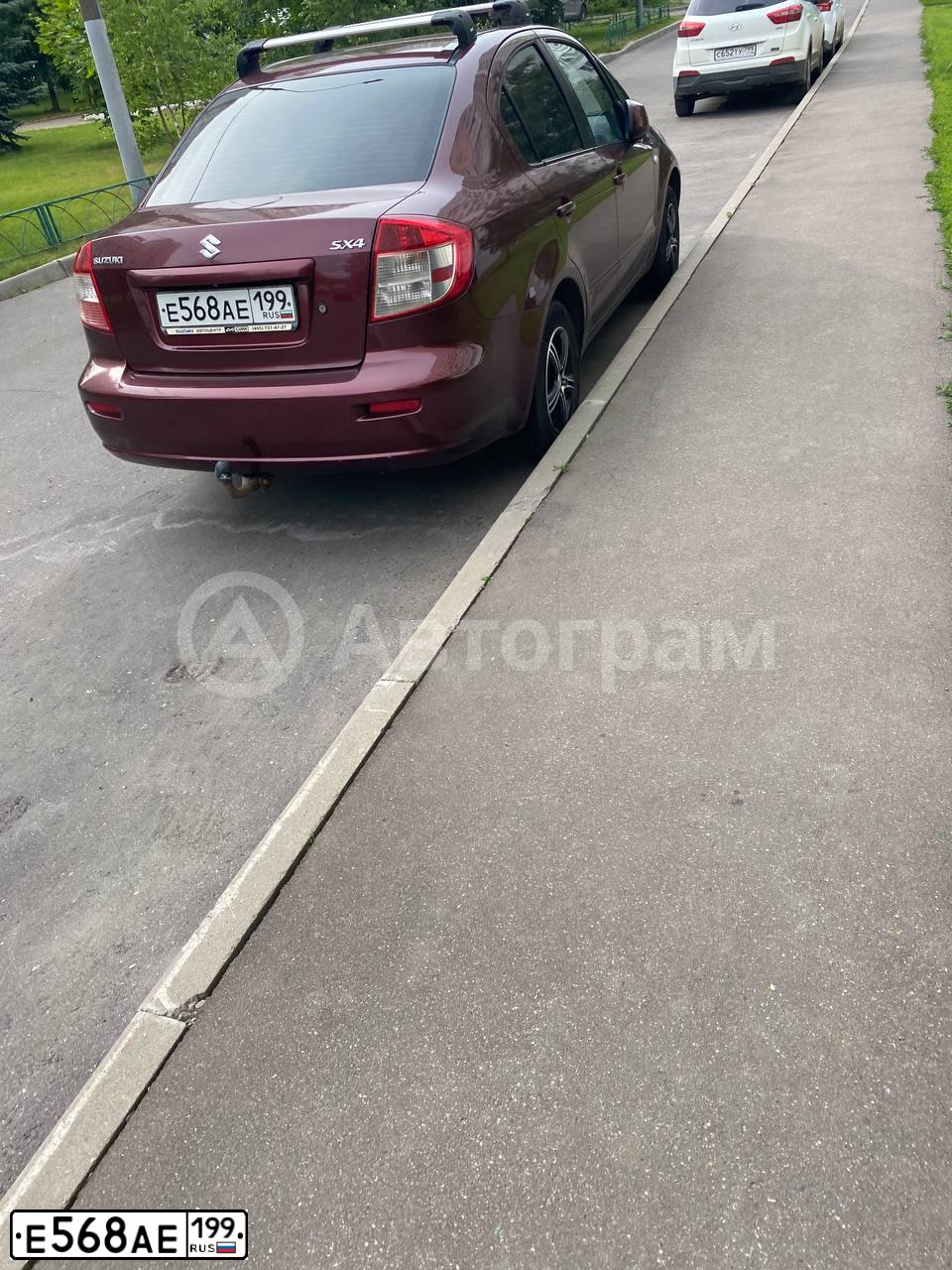 Фото автомобиля SUZUKI SX 4, 2007 — госномер Е568АЕ199. Цвет: КРАСНЫЙ