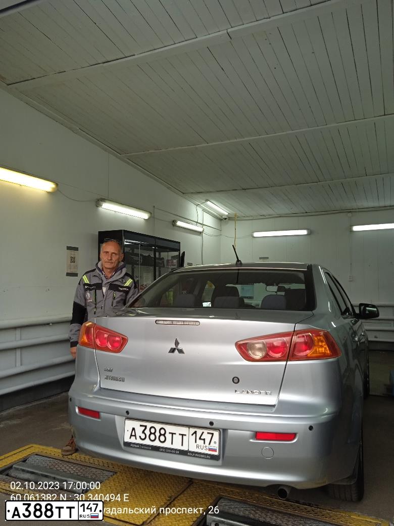 Фото автомобиля MITSUBISHI LANCER, 2009 — госномер С719МТ198. Цвет: Серебристый