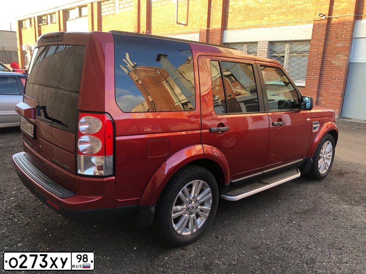 Фото автомобиля LAND ROVER DISCOVERY, 2009 — госномер В085АУ977. Цвет: Красный