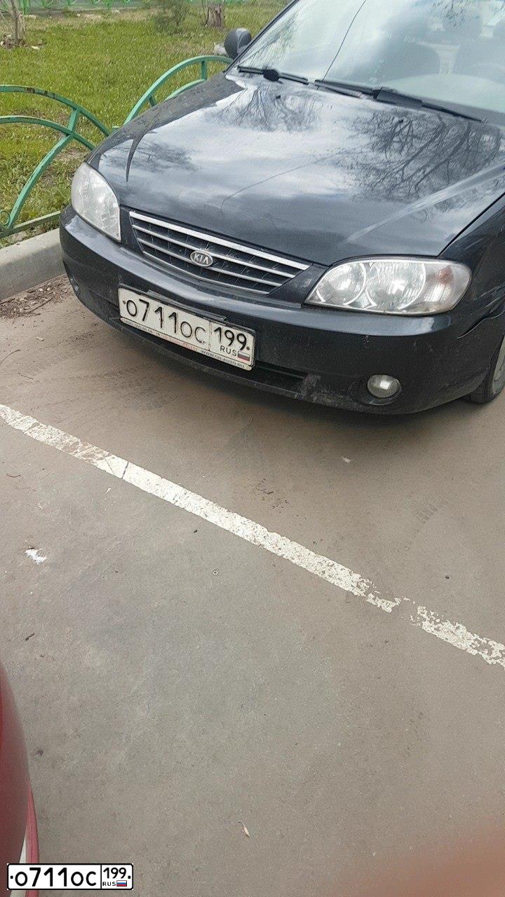 Фото автомобиля KIA SPECTRA, 2007 — госномер О711ОС199. Цвет: ЧЕРНЫЙ