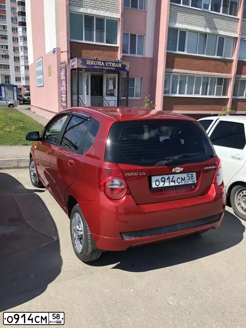 Фото автомобиля CHEVROLET AVEO, 2010 — госномер О914СМ58. Цвет: Красный