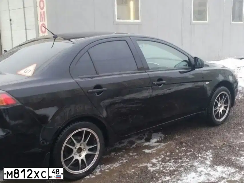 Фото автомобиля MITSUBISHI LANCER, 2013 — госномер М812ХС48. Цвет: ЧЕРНЫЙ