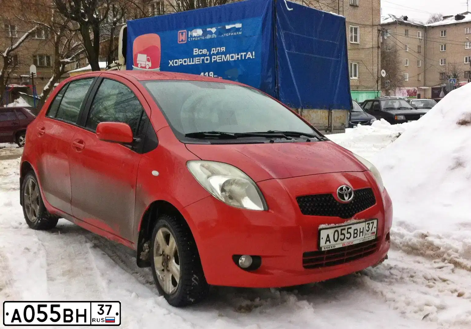 Фото автомобиля TOYOTA YARIS, 2007 — госномер А055ВН37. Цвет: ОРАНЖЕВЫЙ