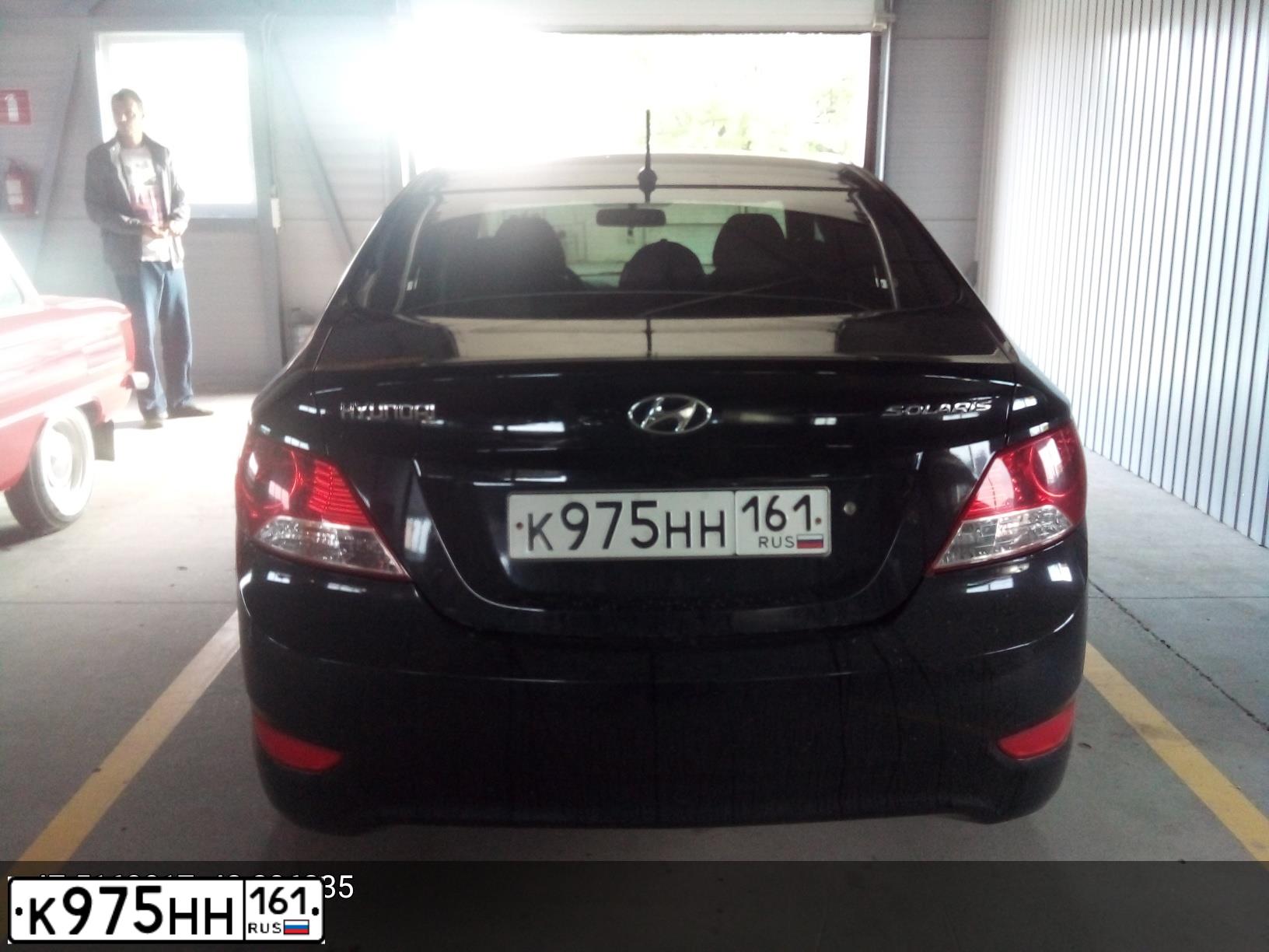 Фото автомобиля HYUNDAI SOLARIS, 2011 — госномер К975НН161. Цвет: ЧЕРНЫЙ