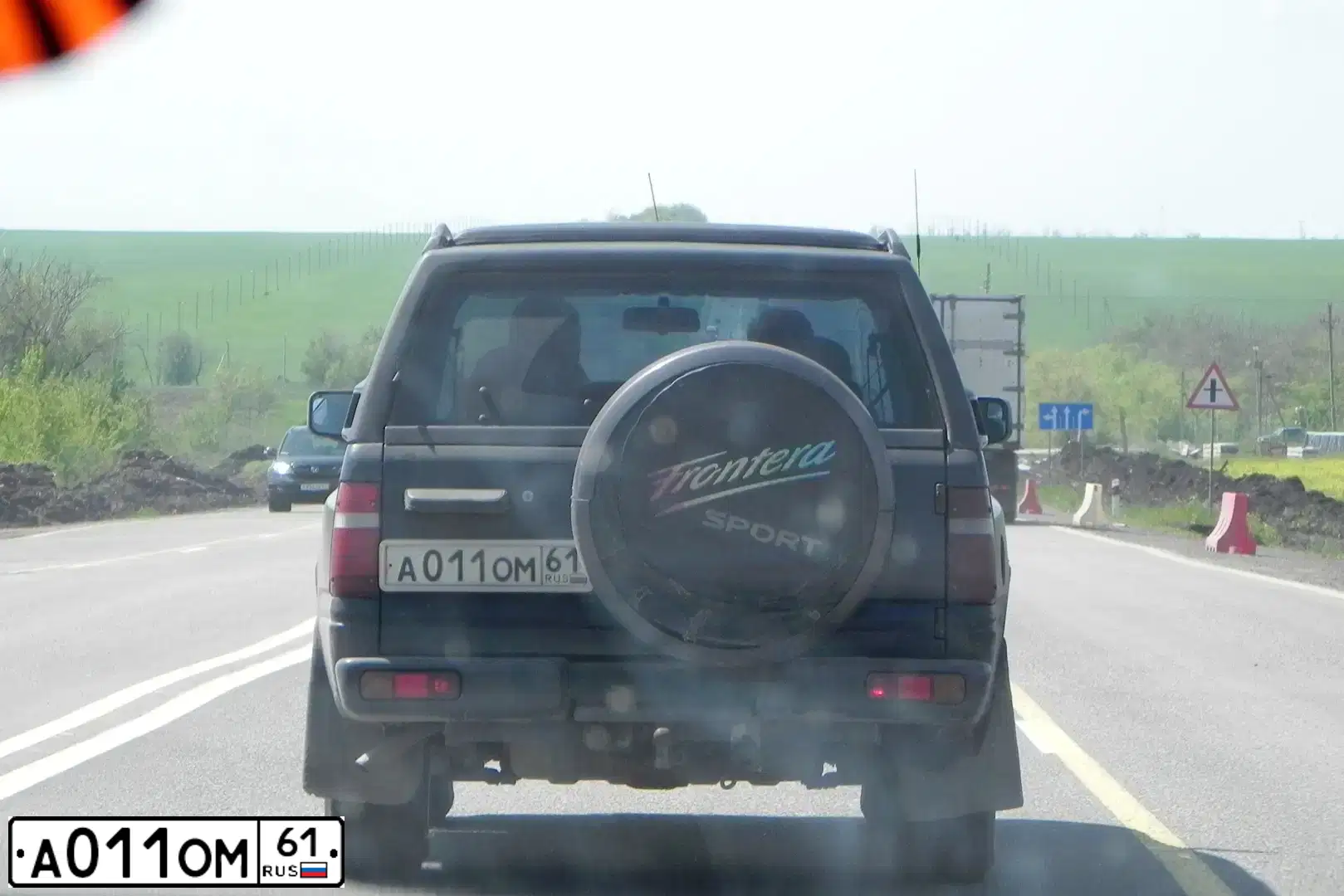 Фото автомобиля OPEL FRONTERA, 1994 — госномер А011ОМ61. Цвет: ЧЕРНЫЙ