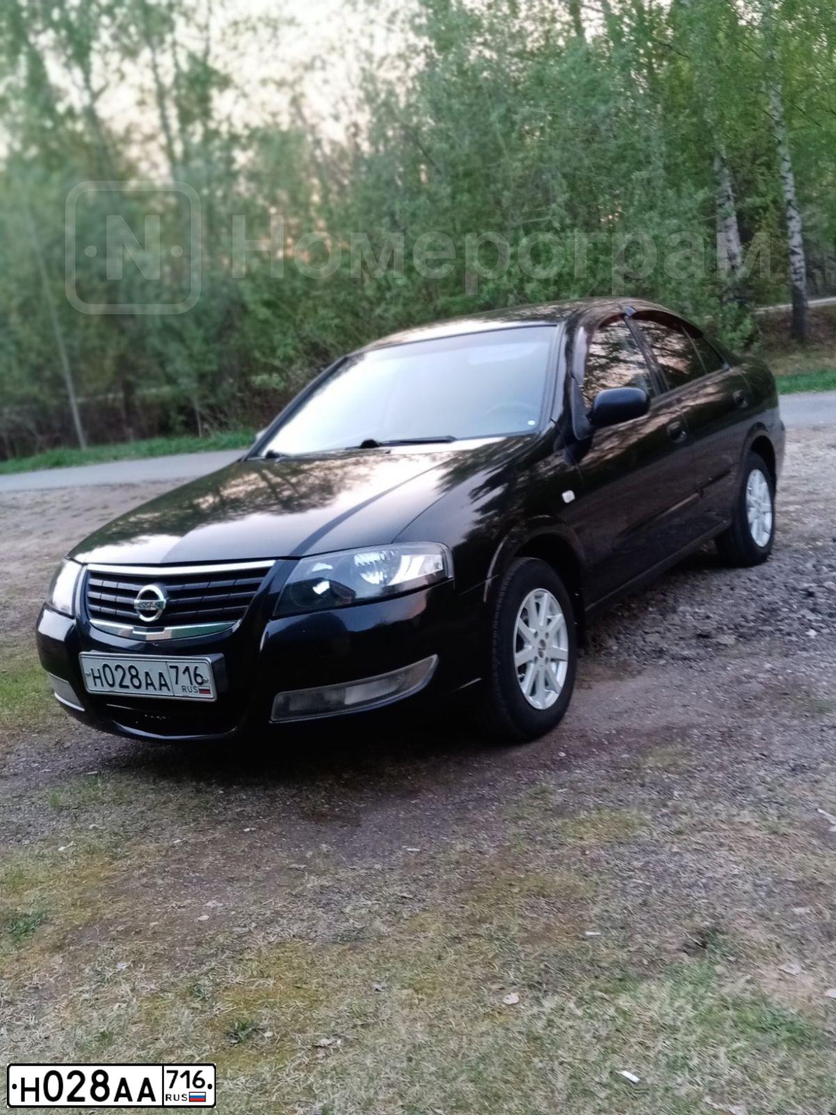 Фото автомобиля NISSAN ALMERA, 2010 — госномер Н163ХТ12. Цвет: ЧЕРНЫЙ