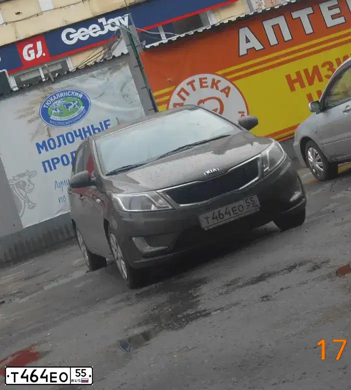 Фото автомобиля KIA RIO, 2014 — госномер Т464ЕО55. Цвет: КОРИЧНЕВЫЙ