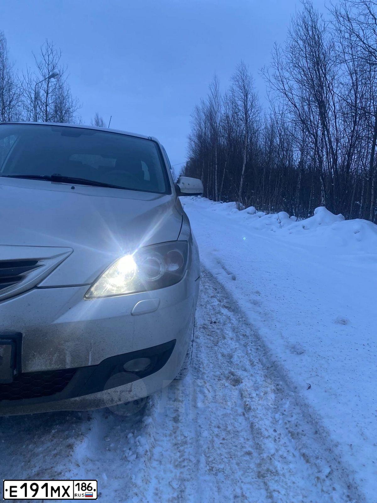Фото автомобиля MAZDA 3, 2007 — госномер К306ЕР72. Цвет: СЕРО-ЗОЛОТИСТЫЙ