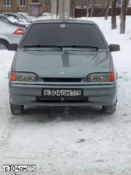 Фото автомобиля LADA 2114 SAMARA, 2006 — госномер Е304ОМ174. Цвет: СРЕДНИЙ СЕРО-ЗЕЛЕНЫЙ МЕТ