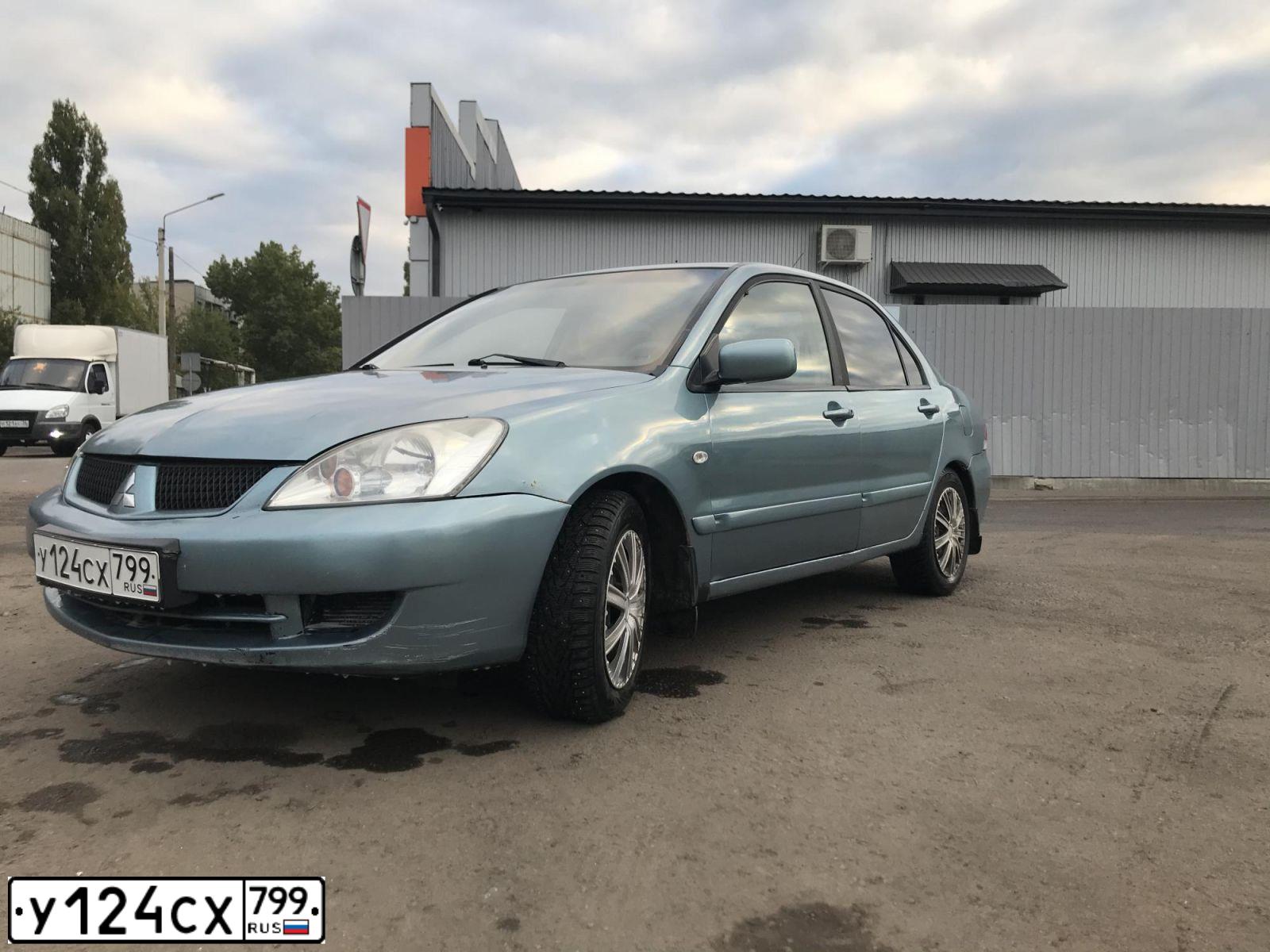 Фото автомобиля MITSUBISHI LANCER, 2005 — госномер У124СХ799. Цвет: СЕРО-ЗЕЛЕНЫЙ