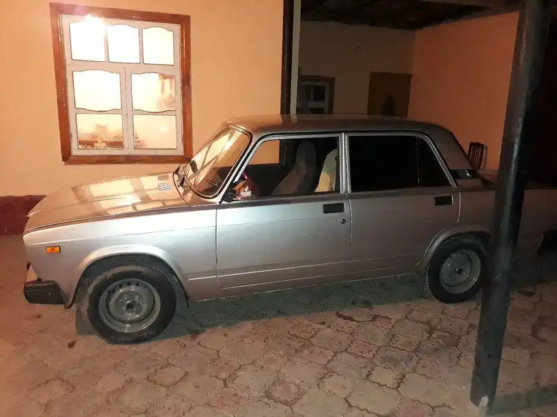 Фото автомобиля LADA 2112, 2007 — госномер М066НМ761. Цвет: СЕРЕБРИСТЫЙ
