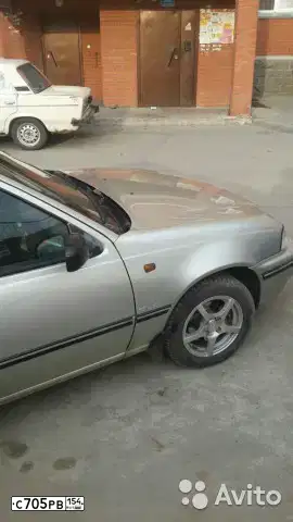 Фото автомобиля DAEWOO NEXIA, 2007 — госномер Н318ЕХ154. Цвет: ПЕРЛАМУТРОВО-СЕРЕБРИСТЫЙ