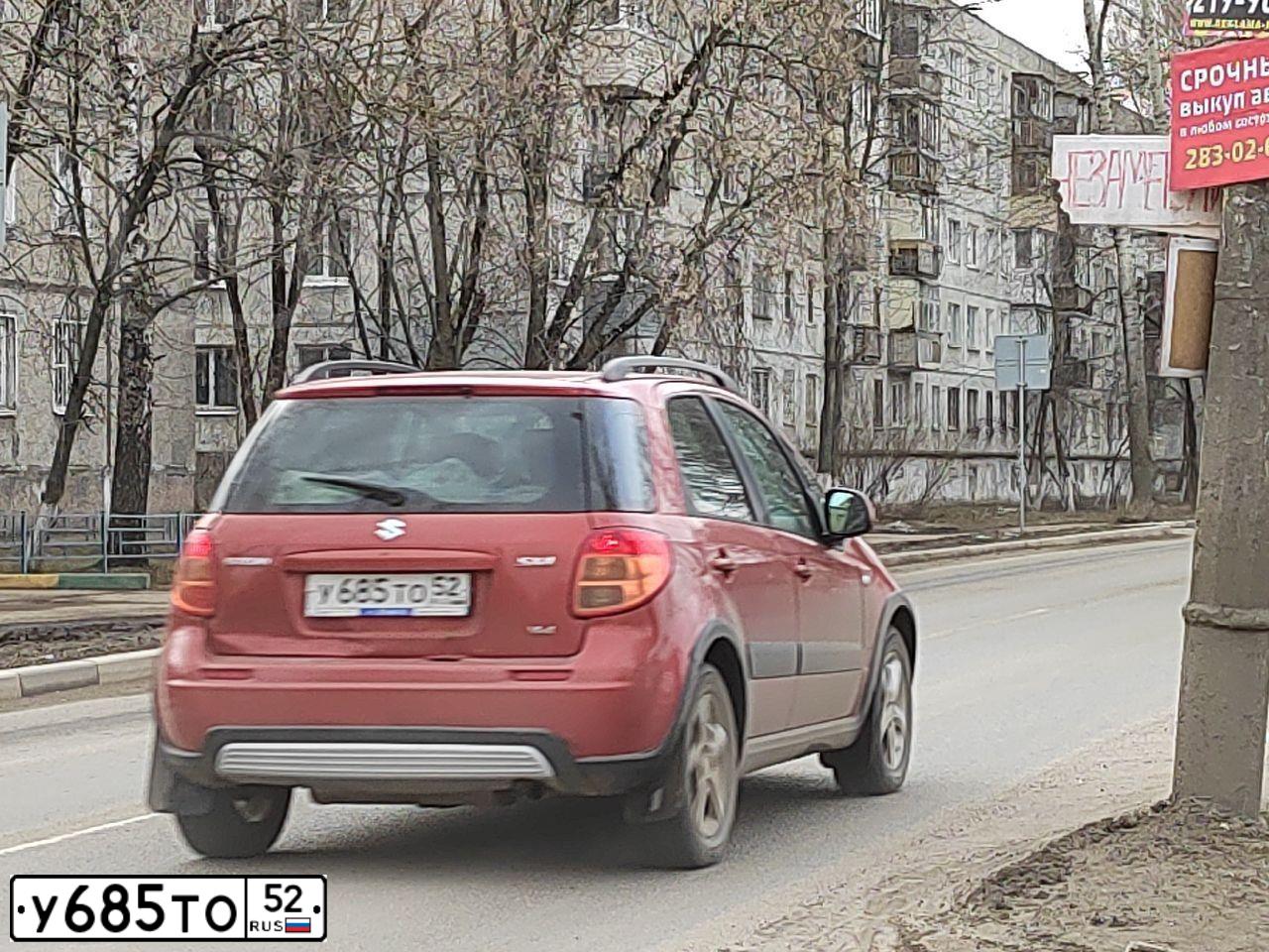 Фото автомобиля SUZUKI SX4, 2008 — госномер Х083ОР152. Цвет: ОРАНЖЕВЫЙ