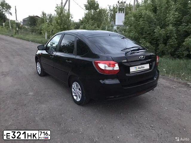 Фото автомобиля LADA GRANTA, 2014 — госномер К957ВК702. Цвет: ЧЕРНЫЙ