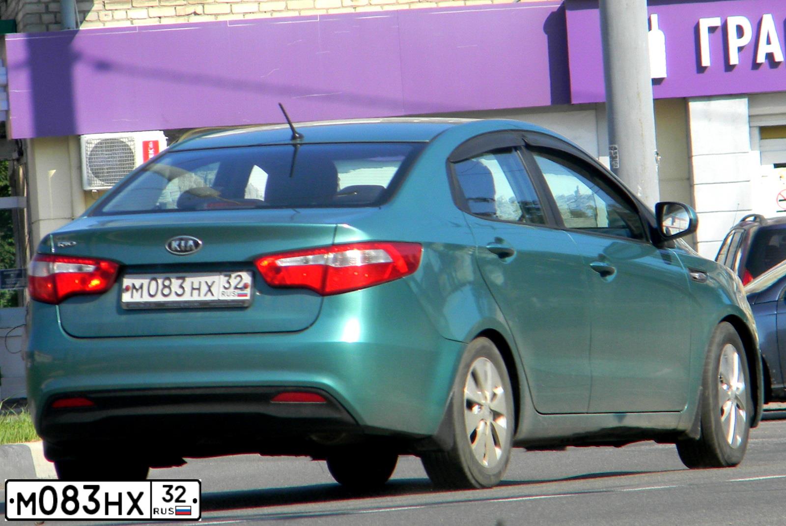 Фото автомобиля KIA RIO, 2012 — госномер О186РУ32. Цвет: СВЕТЛО-ЗЕЛЕНЫЙ