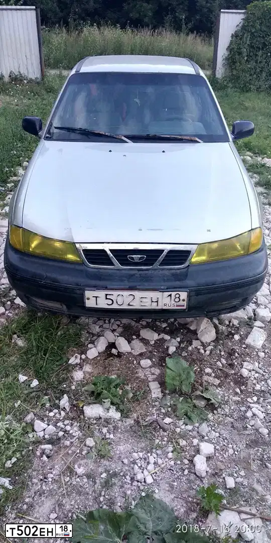 Фото автомобиля DAEWOO NEXIA, 2005 — госномер Т502ЕН18. Цвет: ПЕРЛАМУТРОВО-СЕРЕБРИСТЫЙ
