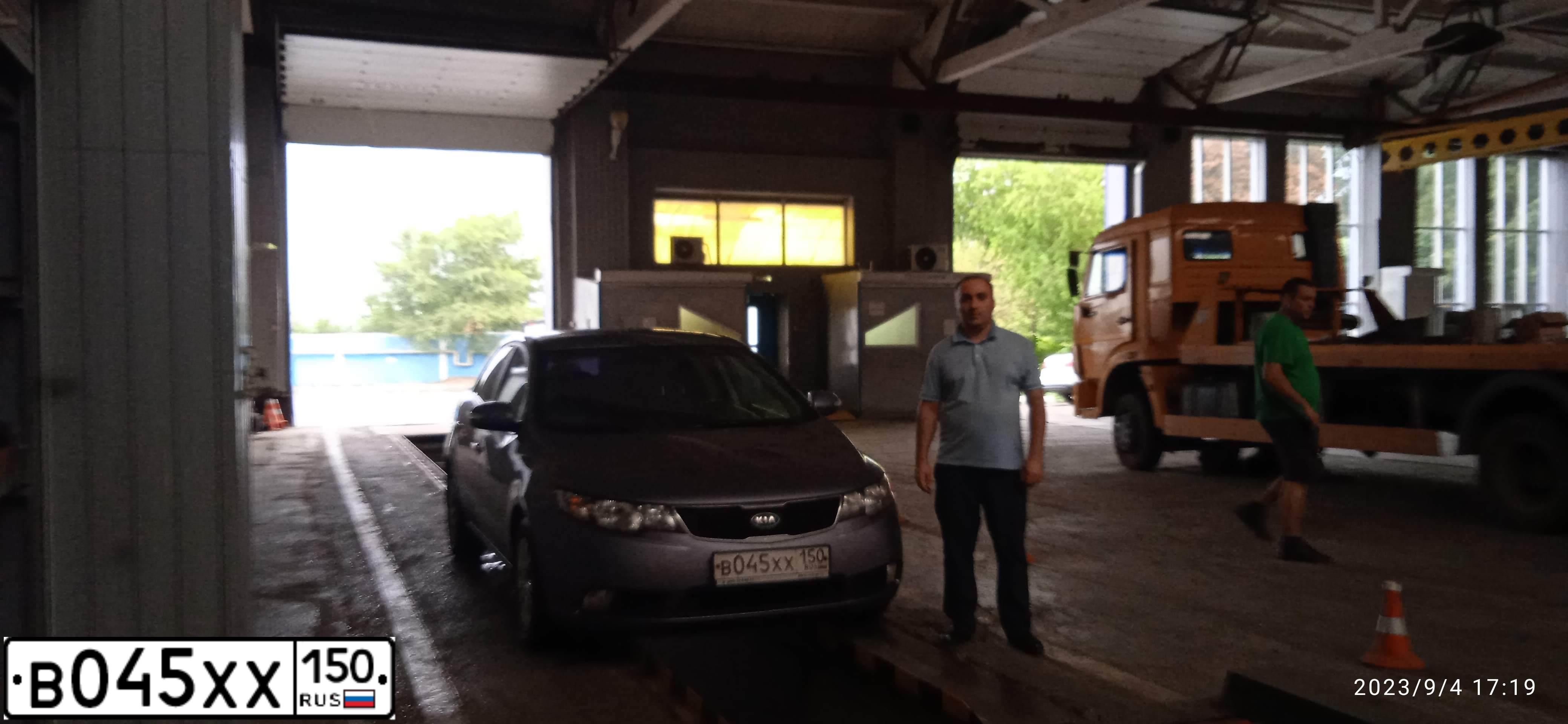 Фото автомобиля KIA CERATO, 2009 — госномер В045ХХ150. Цвет: СВЕТЛО-СЕРО-ГОЛУБОЙ