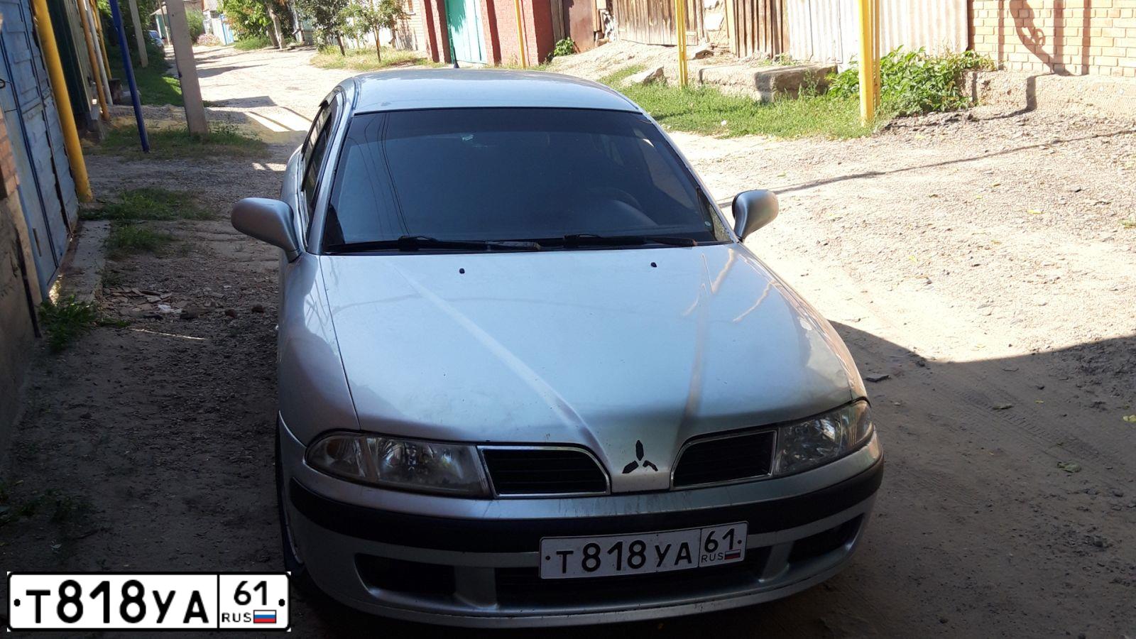 Фото автомобиля MITSUBISHI CARISMA, 2001 — госномер Т818УА61. Цвет: СЕРЕБРИСТЫЙ