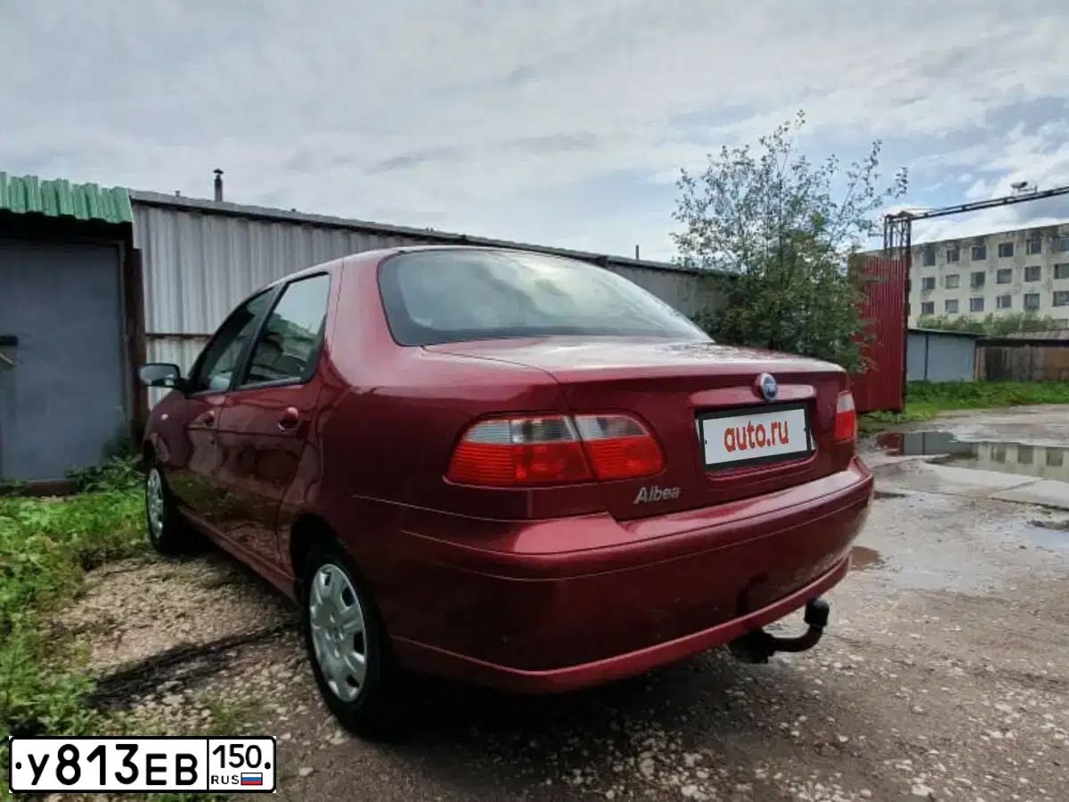 Фото автомобиля FIAT ALBEA, 2007 — госномер Н769ЕЕ134. Цвет: КРАСНЫЙ СЦИЛЛА