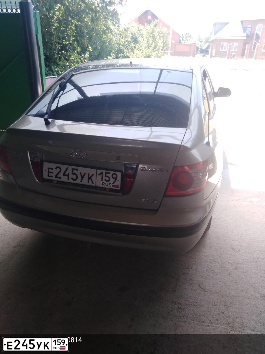 Фото автомобиля HYUNDAI ELANTRA, 2006 — госномер Е245УК159. Цвет: БЕЖЕВЫЙ
